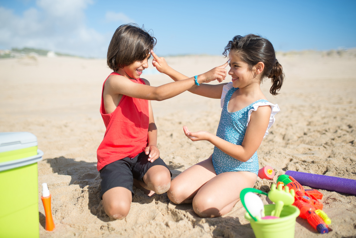 Kids Applying Cream on Their Faces